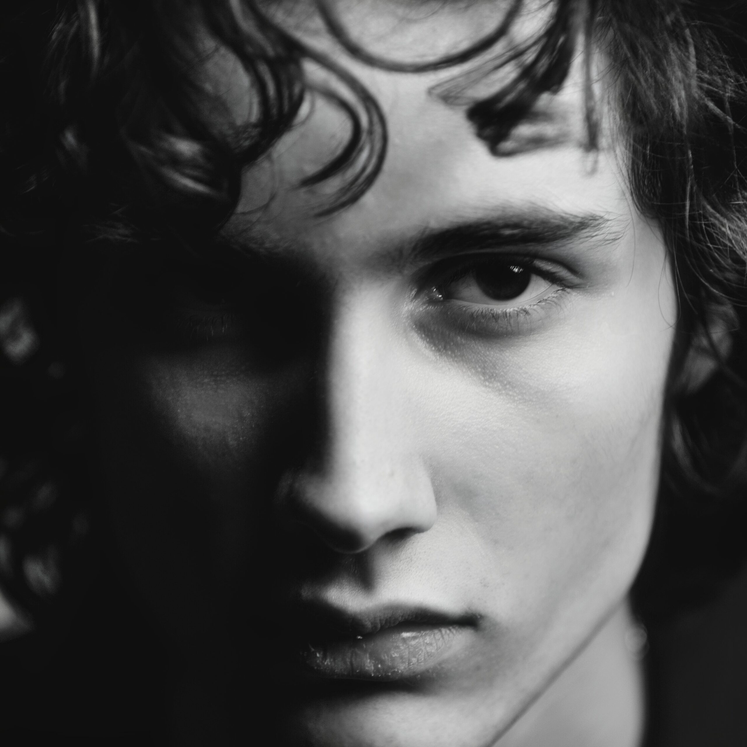 Black and white closeup photo of Sombr