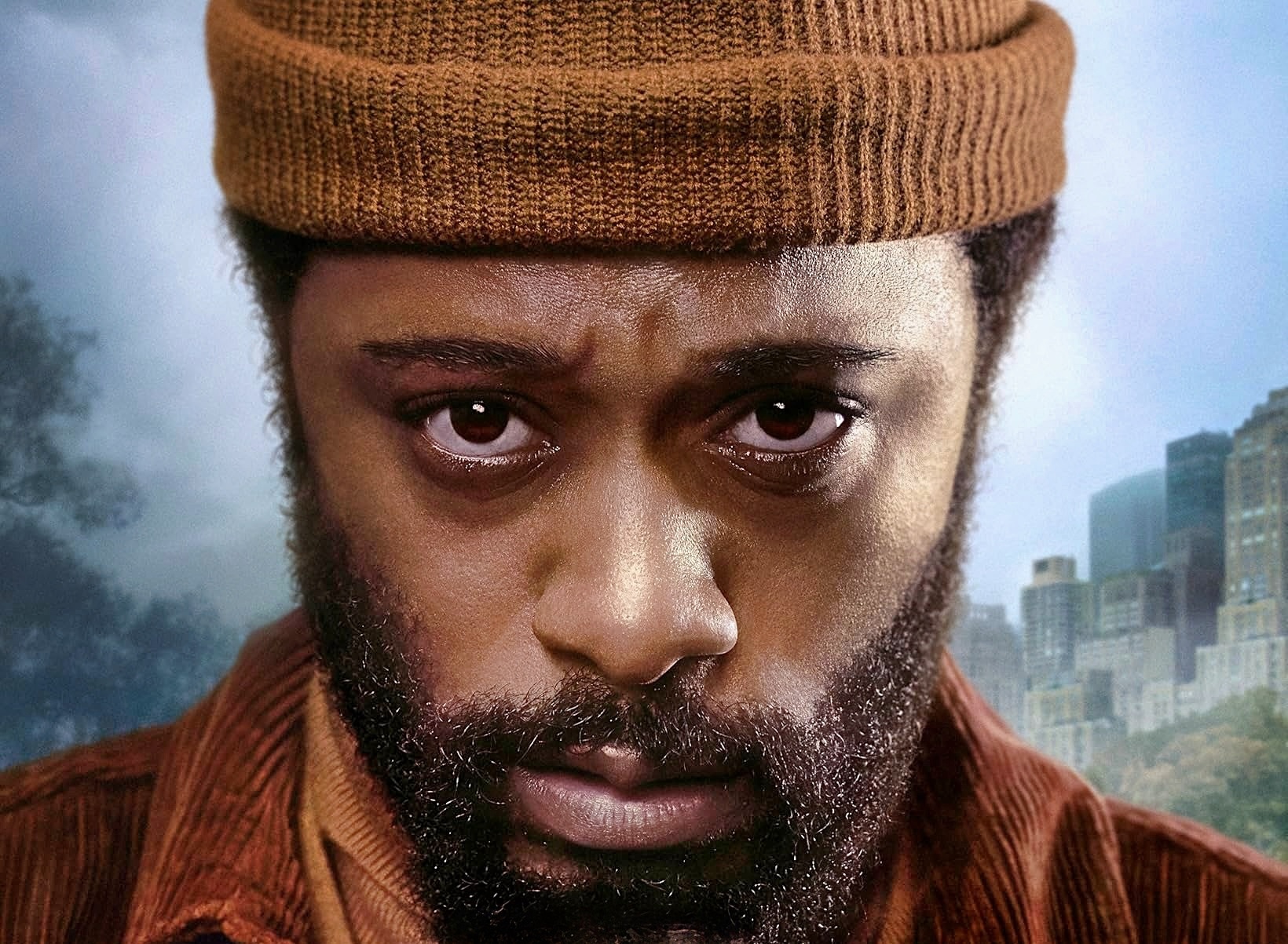 a closeup color photograph of an african american man wearing a brown wool hat